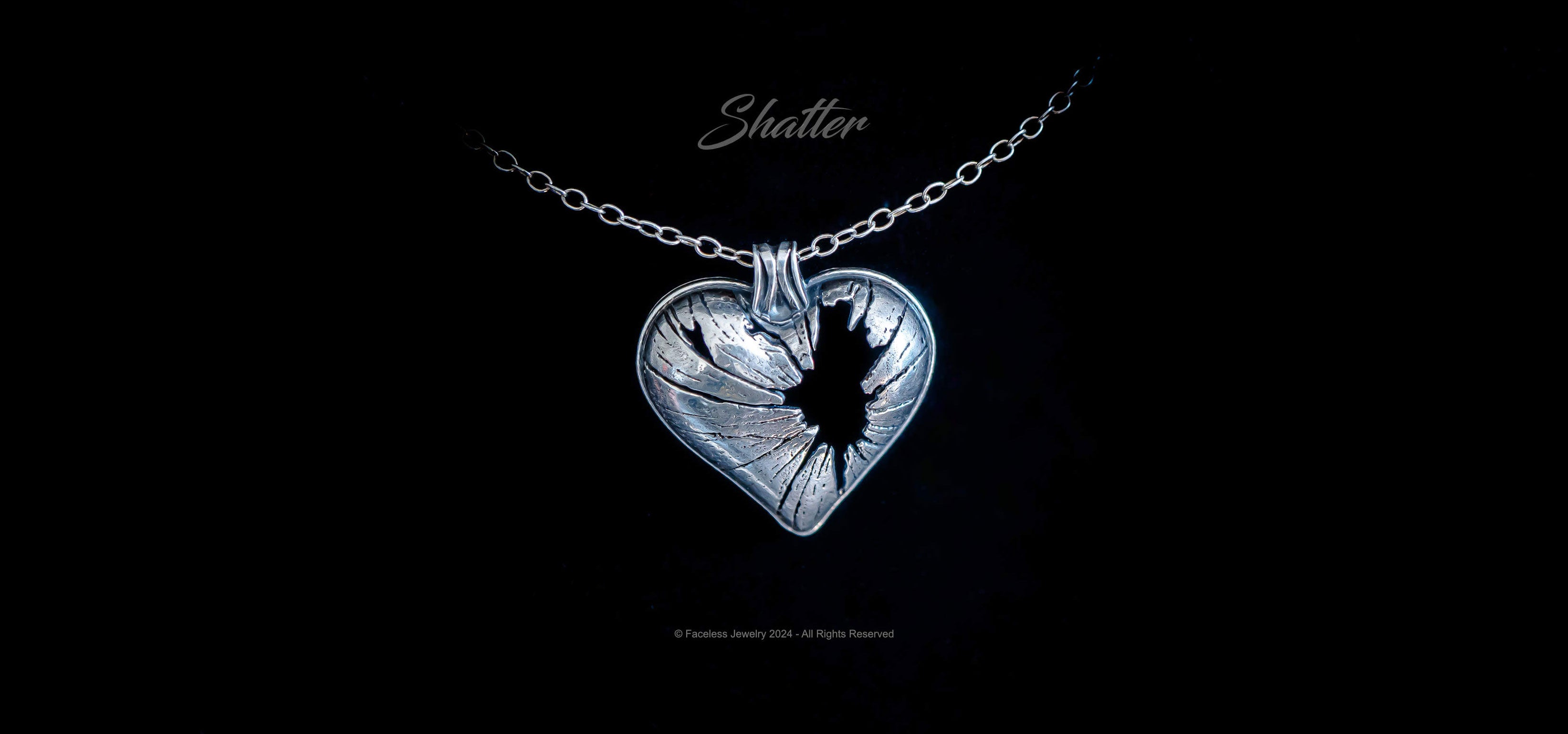 shatter-broken-heart-pendant---faceless-jewelry---sterling-silver-gothic-jewelry314wide.jpg__PID:f37fceaa-7b5f-4bcd-b401-3e9cbc8cc2b8