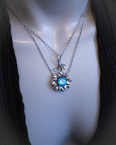 Necklace with a blue gemstone pendant on a mannequin